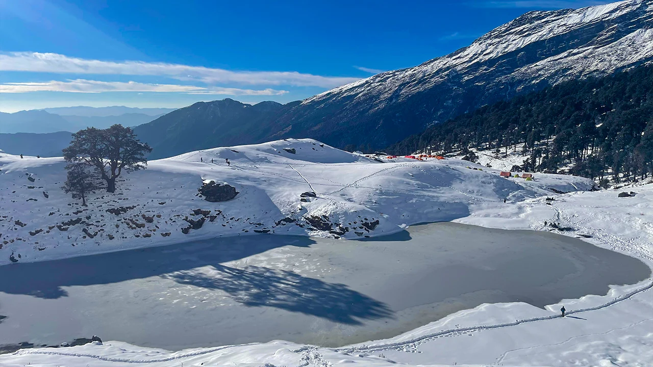 A picturesque view of a frozen lake at Brahmatal Trek, Trek The Himalayas