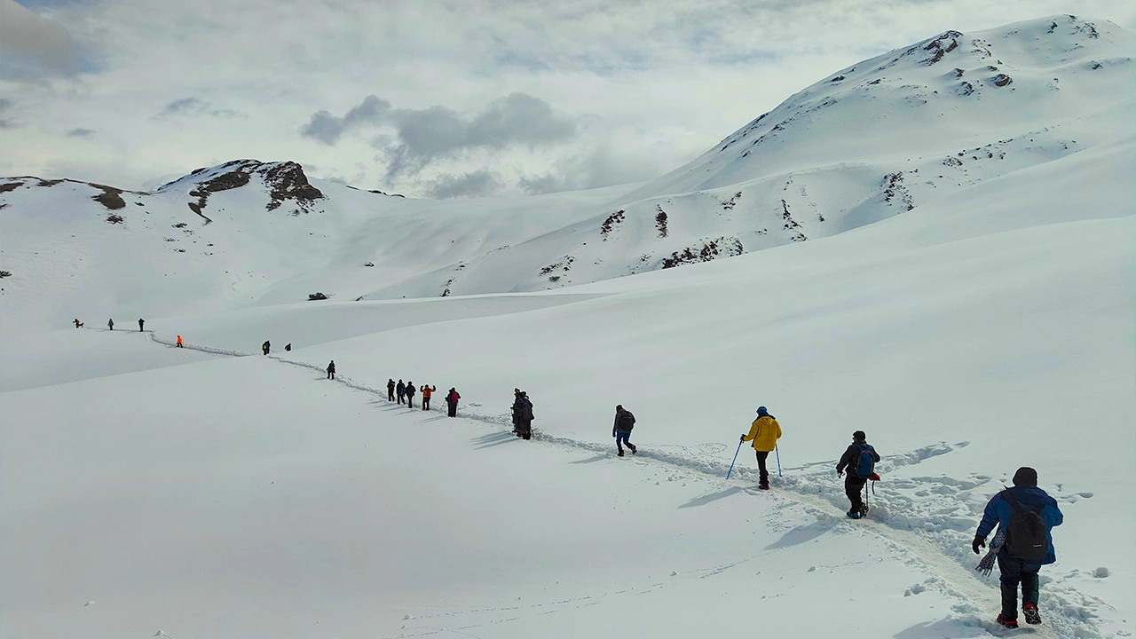 Trek The Himalayas, Group of trekkers hiking through the Himalayas during an adventure expedition