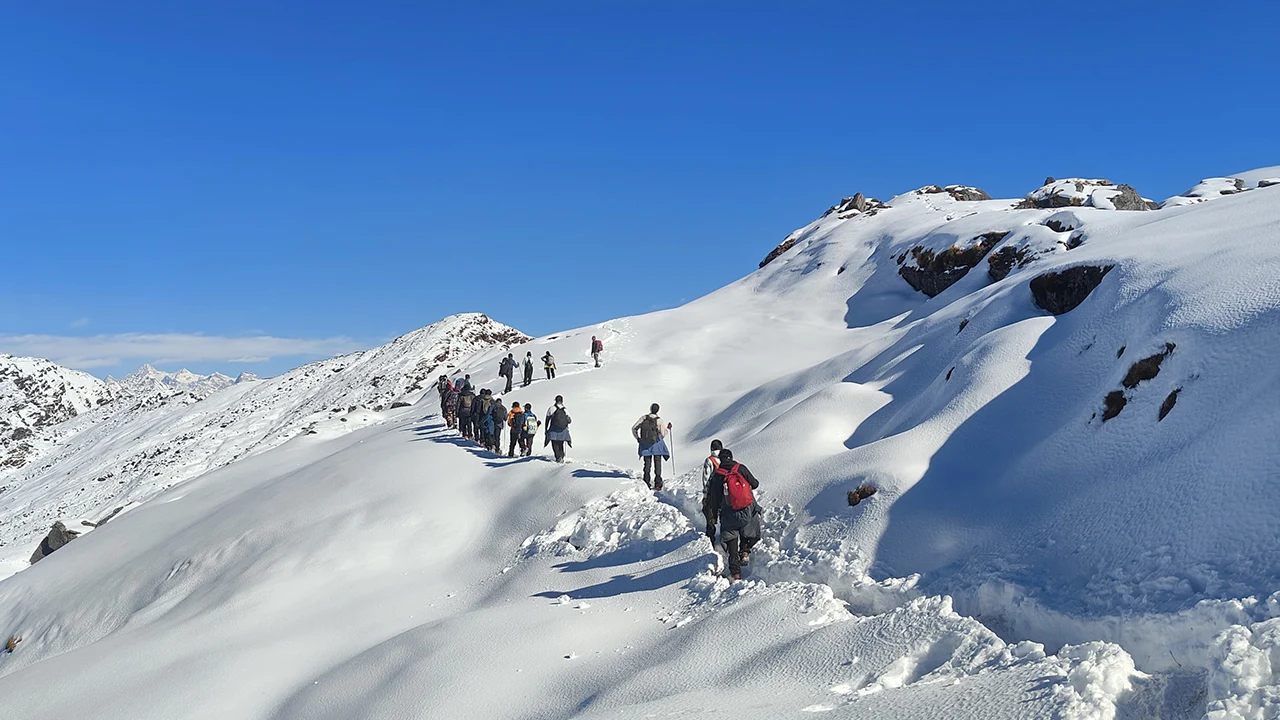 Scenic view from Brahmatal Trek featuring snow-covered mountains, untouched landscape, hikes of india