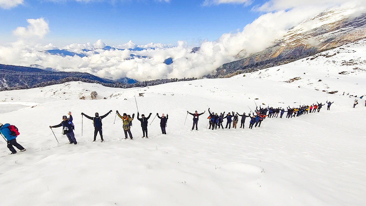 On Day 5 of the Brahmatal Trek, trekkers descend to Lohajung while celebrating their successful summit