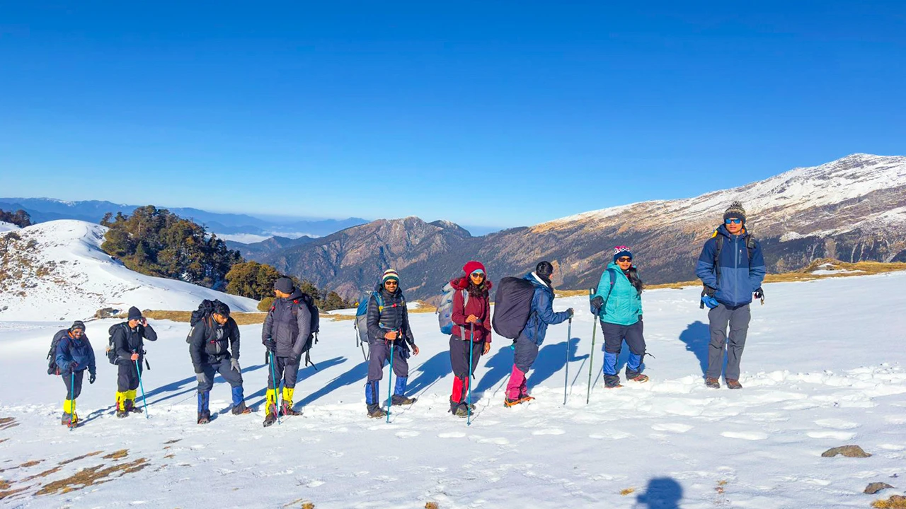 Hikers climbing along the ridge on the Brahmatal trek