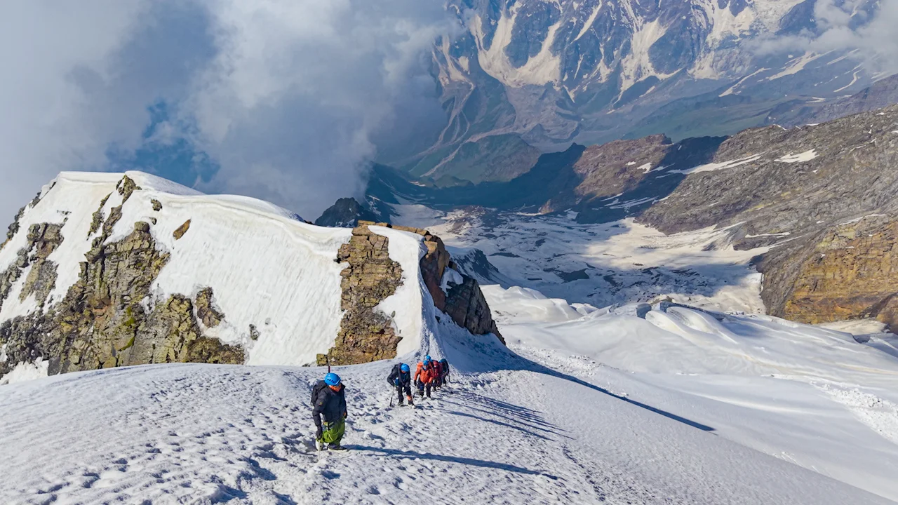Trekkers climbing a difficult expedition route.